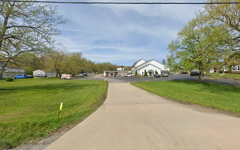 Santore & Associates health and wellness clinic building exterior on tree-lined driveway