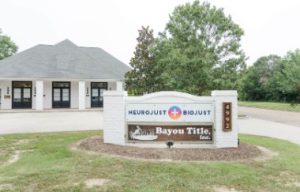 NeuroJust Baton Title storefront building with sign and landscaping