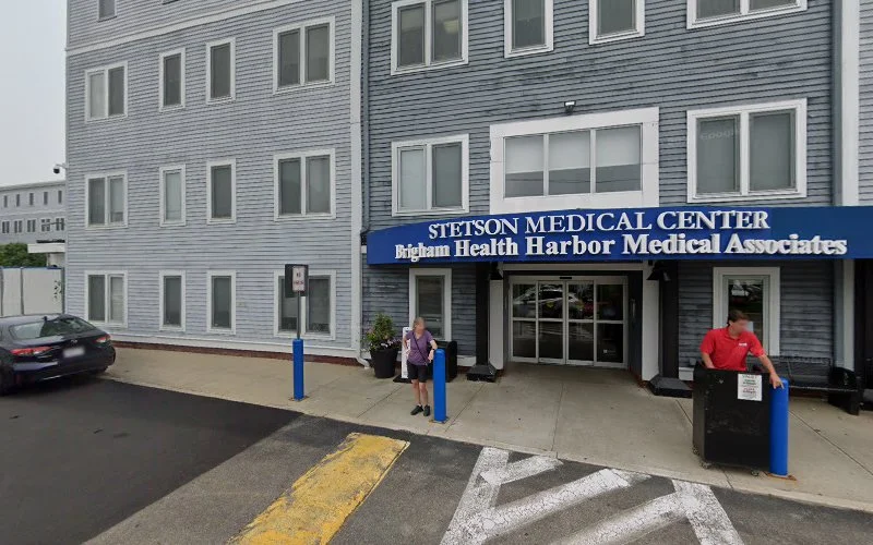 Stetson Medical Center, Eggam Health Harbor Medical Associates building entrance with blue awning and staff outside
