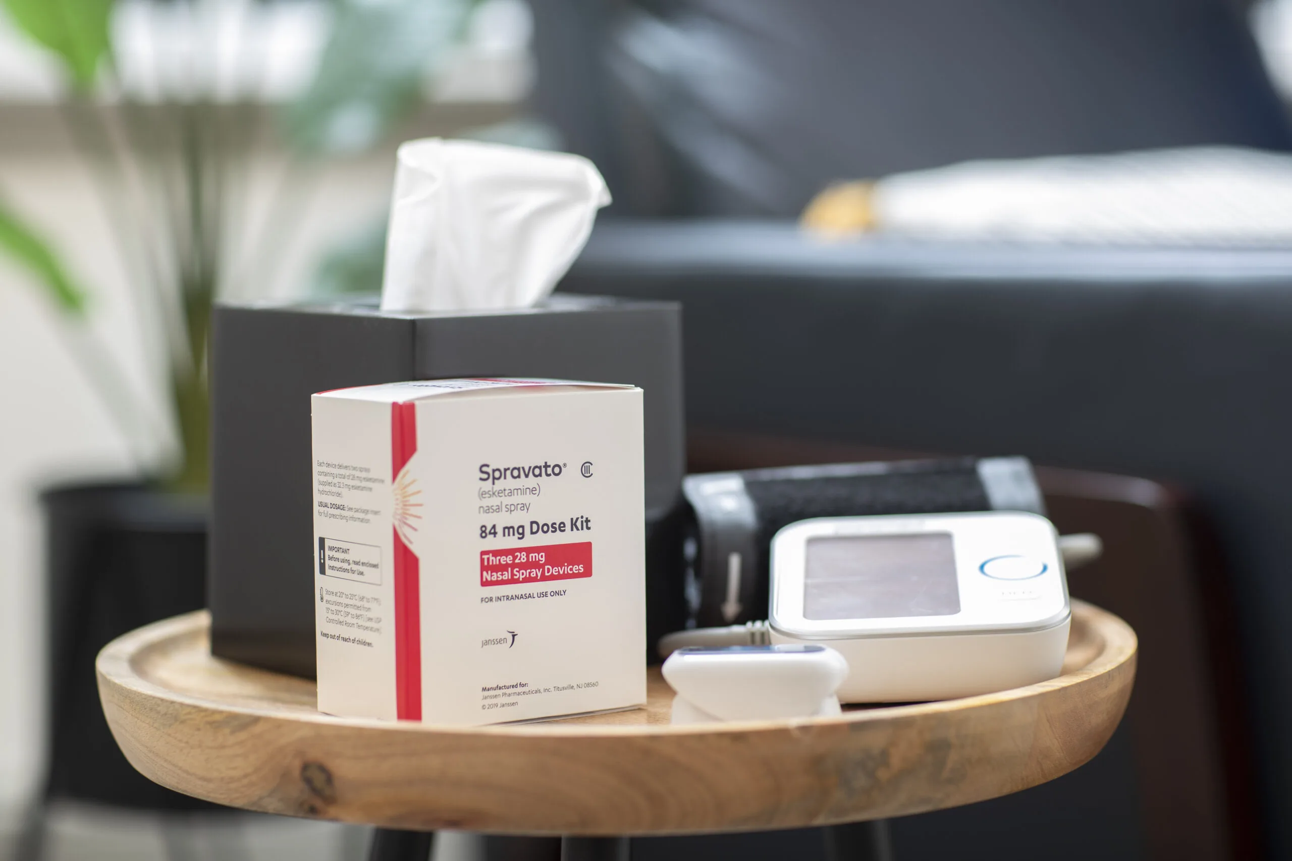 Spravato nasal spray dose kit displayed on wooden tray in clinical setting