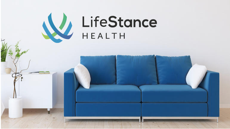 LifeStance Health office interior with blue sofa and white side table