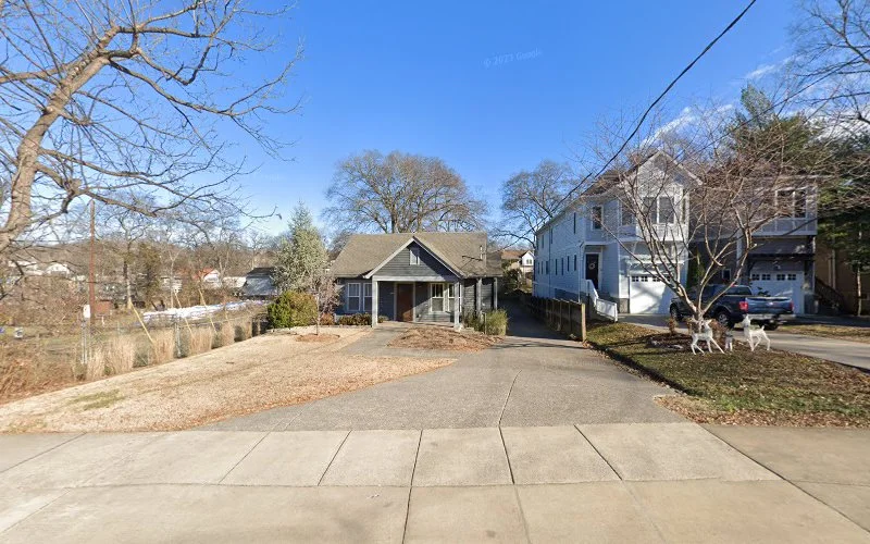Residential Tennessee street with single-story medical building among houses and bare trees