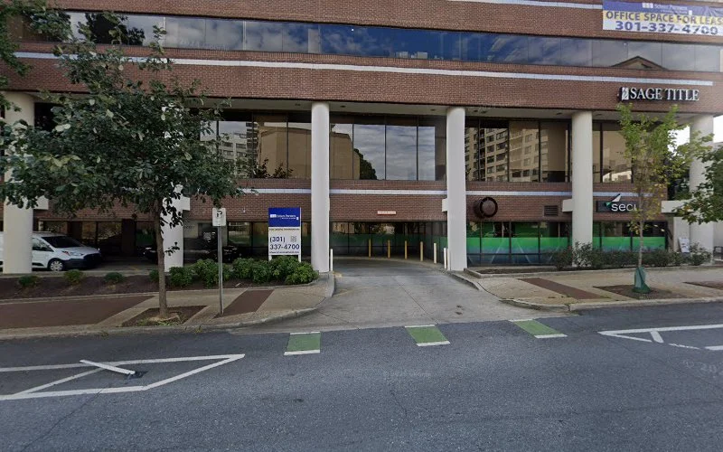 Vesta, Inc. brick building exterior with large windows and ground-level entrance