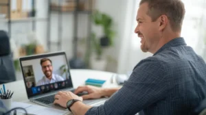 Man on video call with healthcare provider on laptop screen