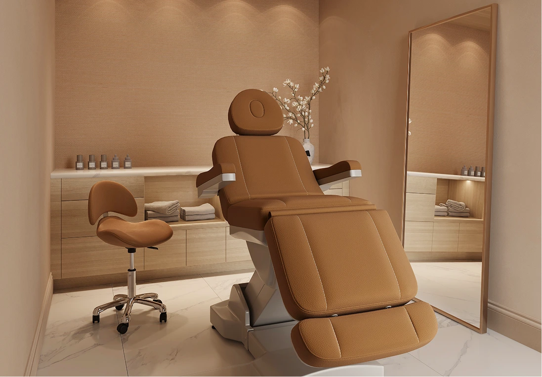 Spa treatment room featuring brown leather facial chair with footrest and matching stool