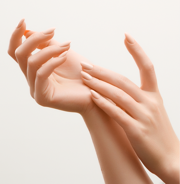 Two hands with manicured nails displayed against neutral background