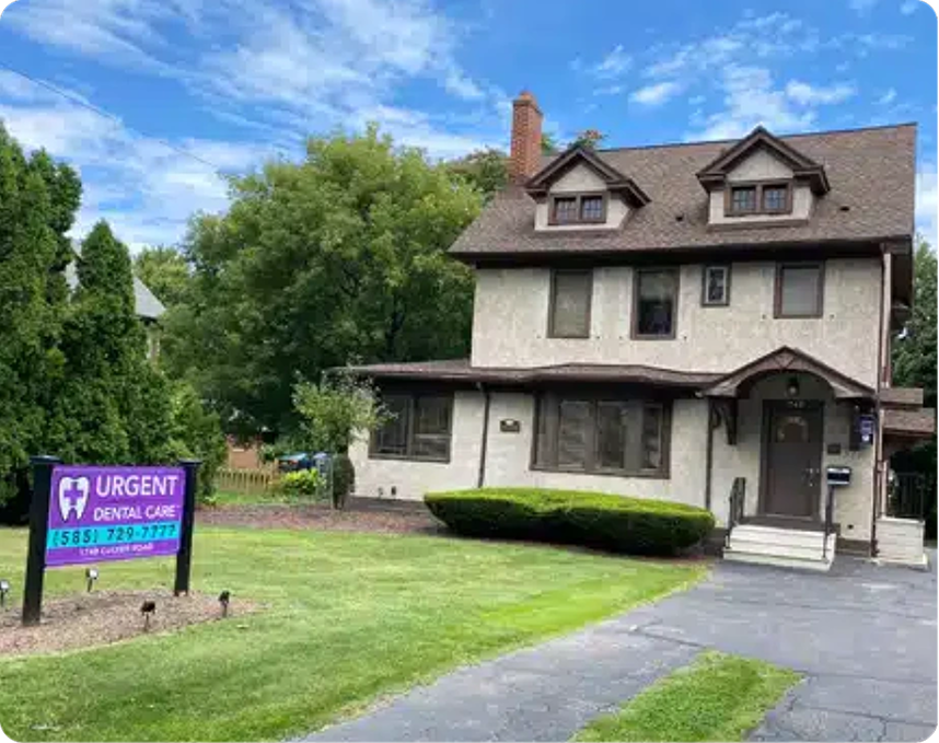 Urgent Dental Care sign on lawn in front of two-story residential house