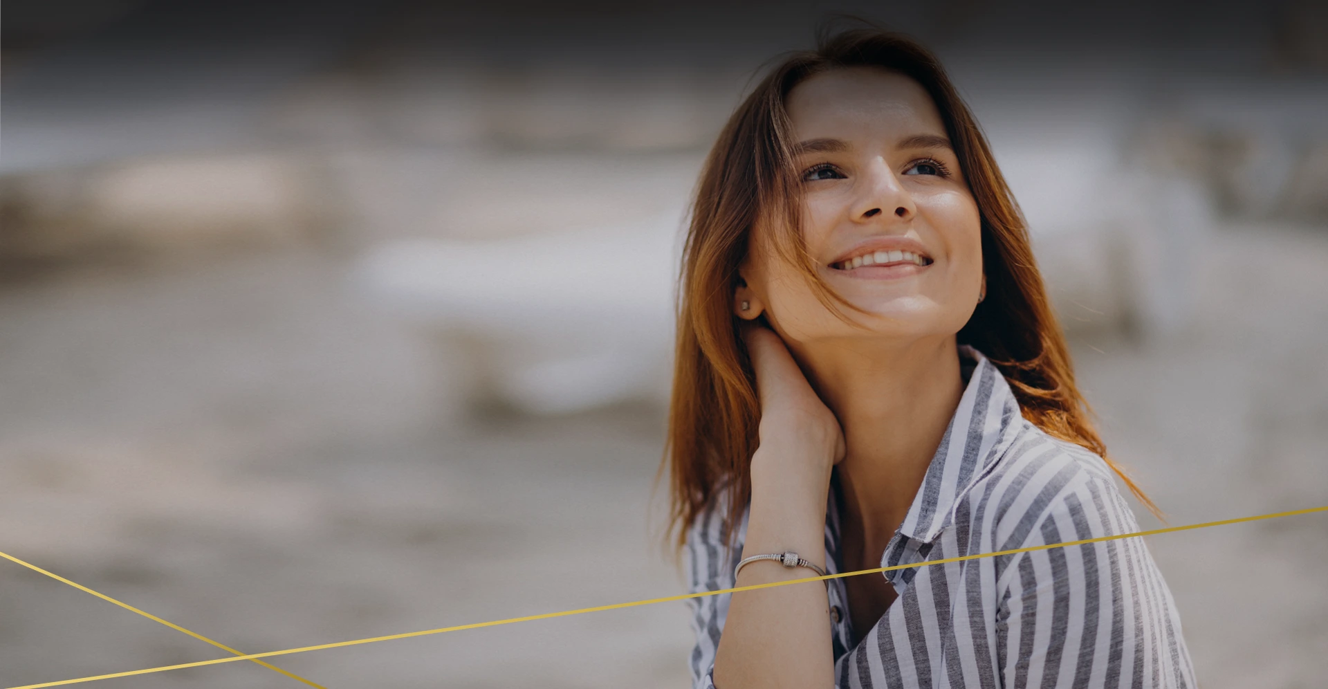 Smiling woman touching her neck and jawline, illustrating smoother, firmer skin goals for Morpheus8 treatment in Chandler, AZ