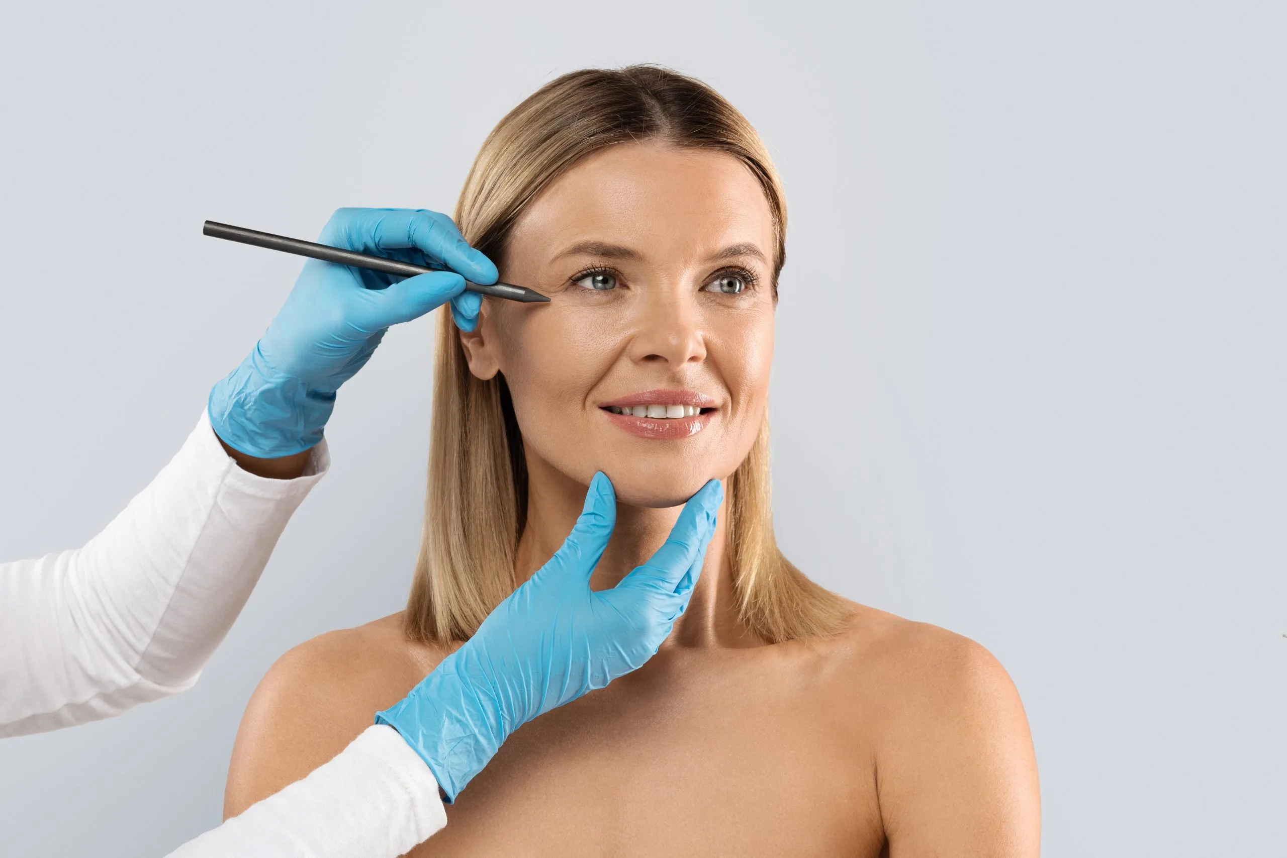 Provider marking the face before a thread lift consultation