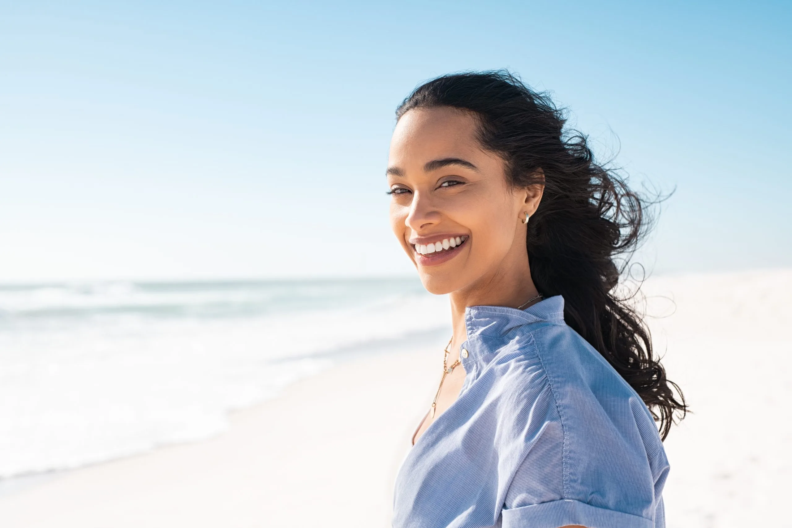 Smiling young woman at the sea looking at the camera – SPRAVATO treatment in Livermore, CA