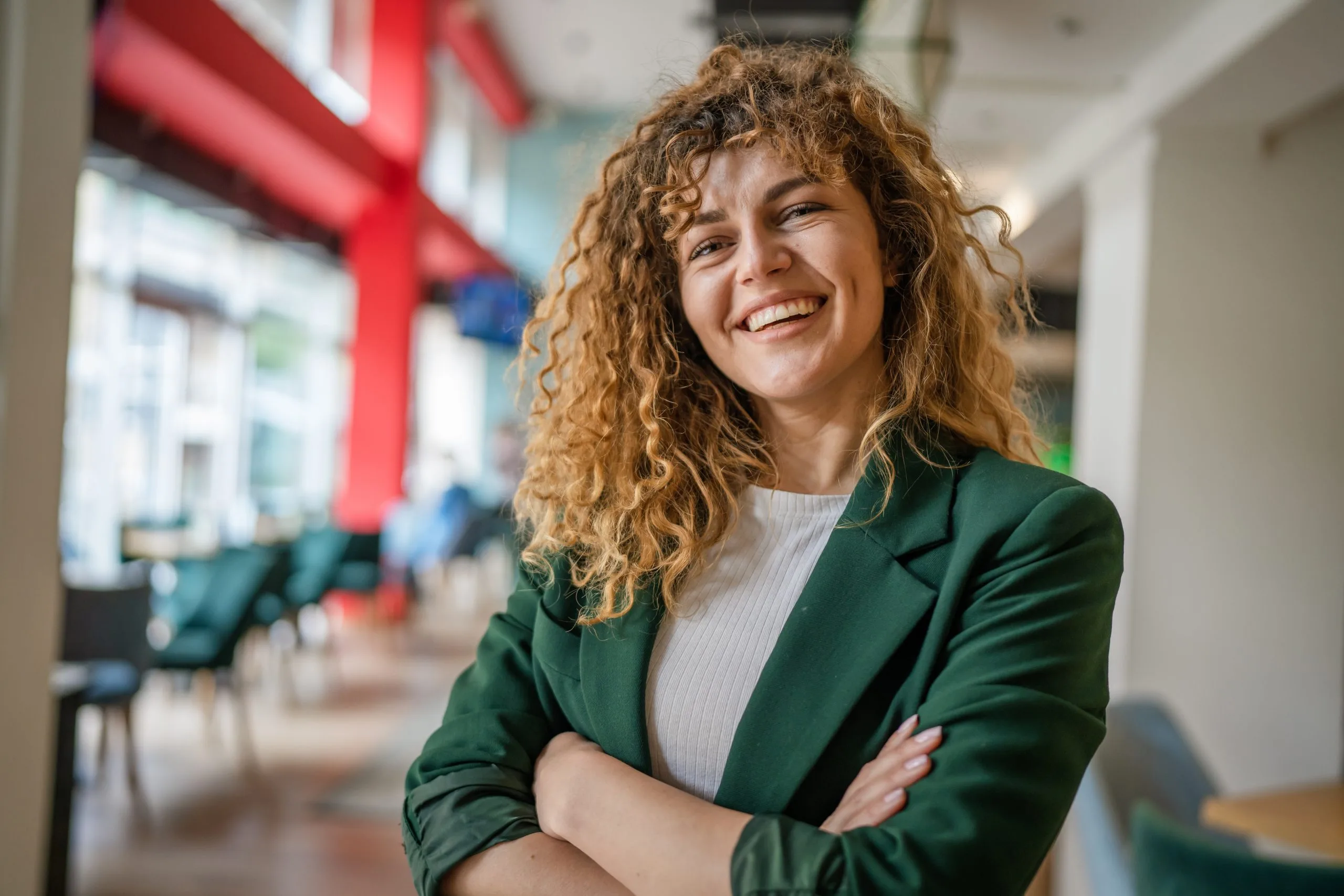 Happy, confident woman standing indoors at a cafe – SPRAVATO treatment in Lafayette, CA