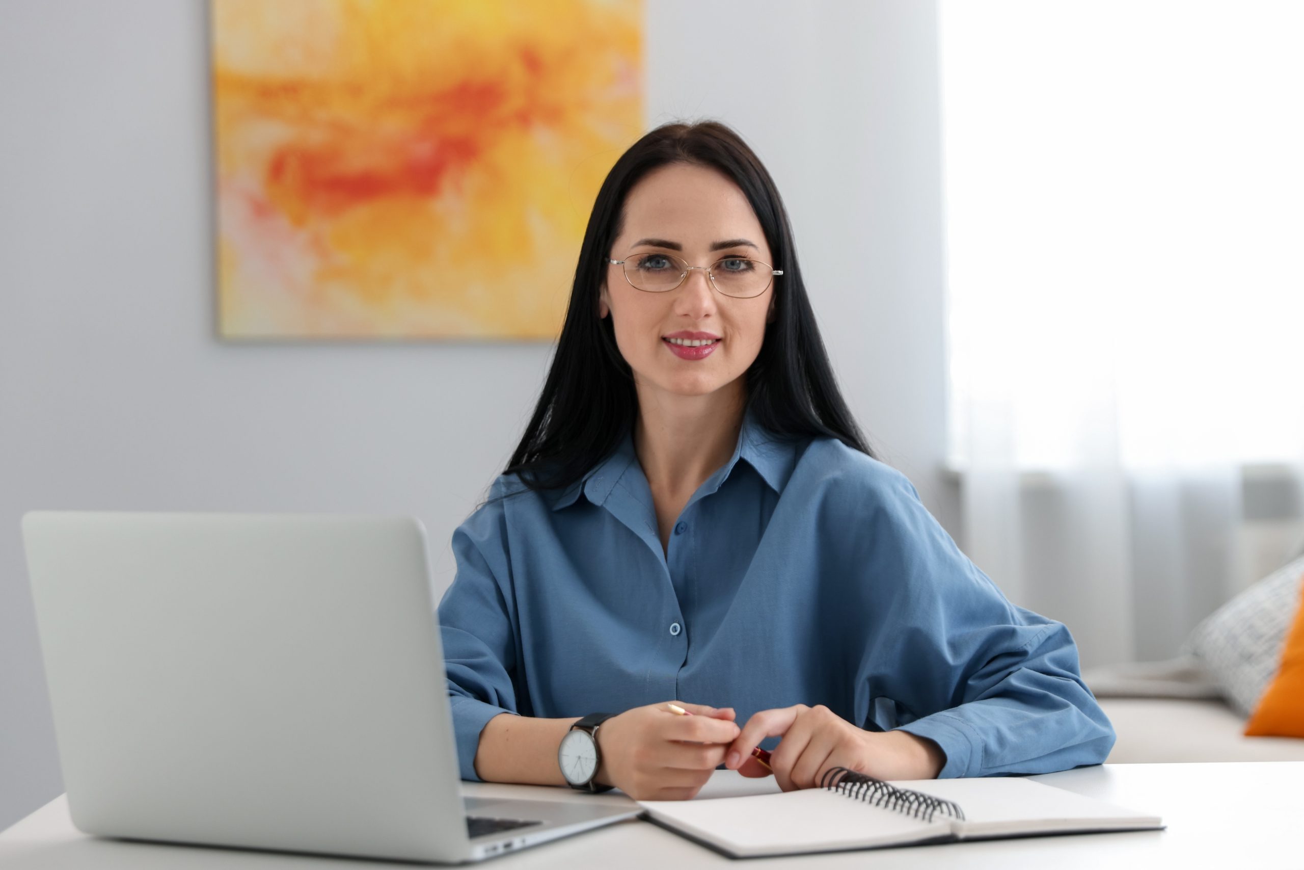 Clinician with laptop, notebook and pen at a table – SPRAVATO treatment in Dublin, CA