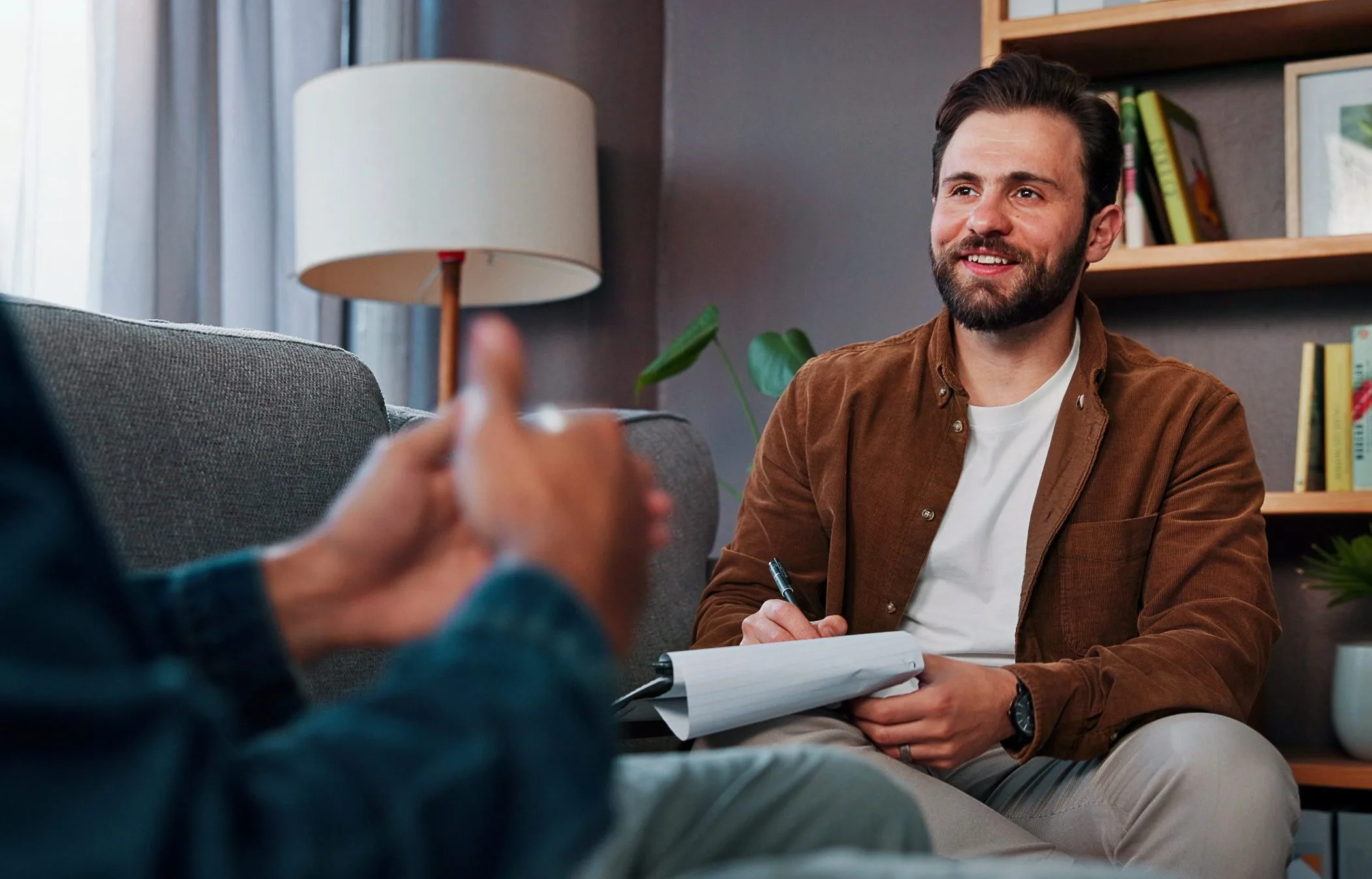 Therapist listening with a clipboard during a mental health session – SPRAVATO treatment in San Ramon, CA