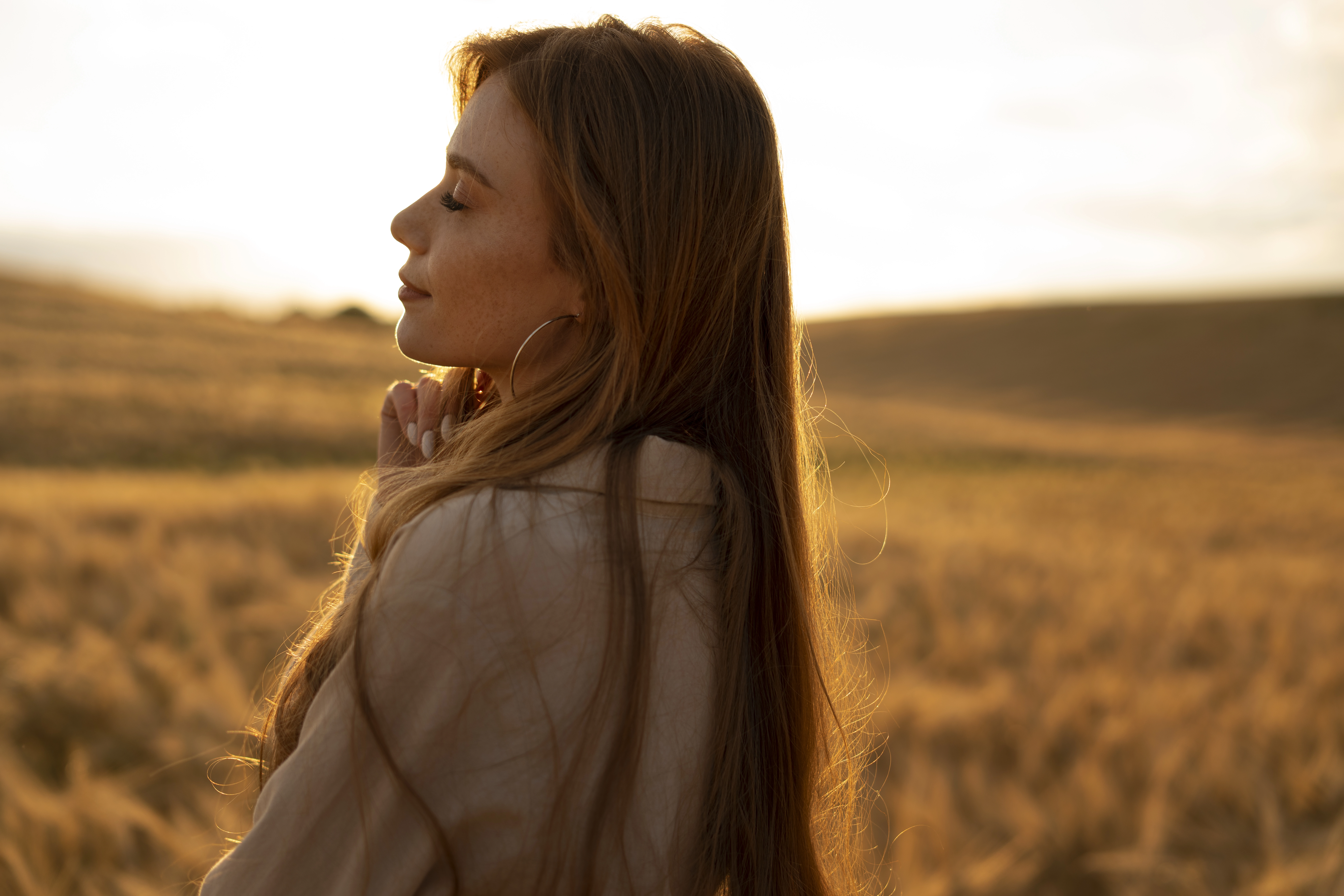 Woman outdoors taking a calm, mindful moment