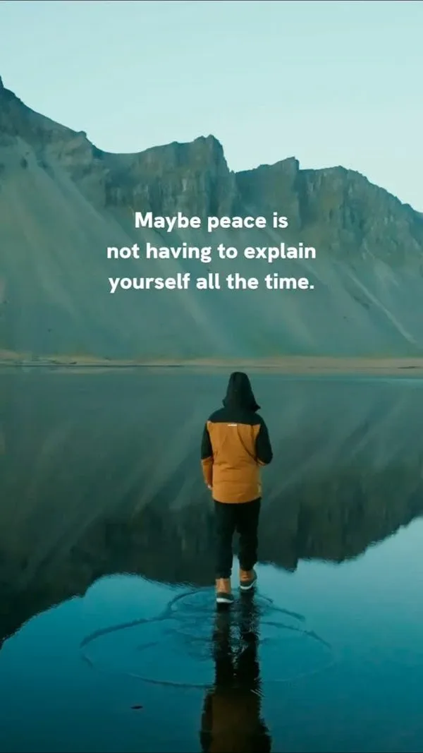 Person standing in a still mountain lake with the words: maybe peace is not having to explain yourself all the time