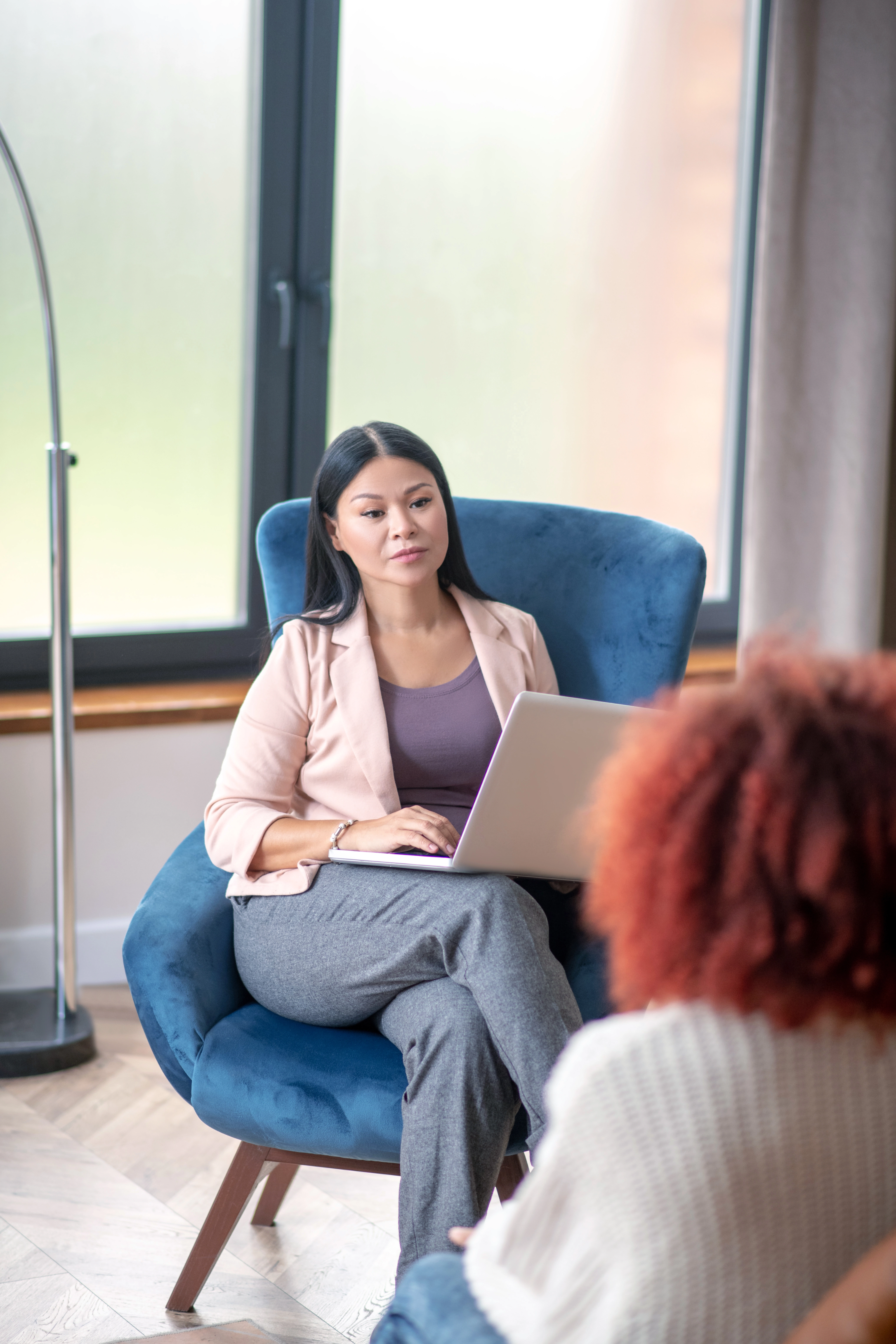 Young woman talking with her psychotherapist