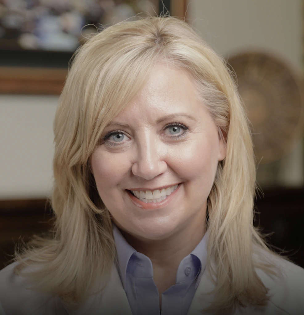 Portrait of female dentist smiling in dental office
