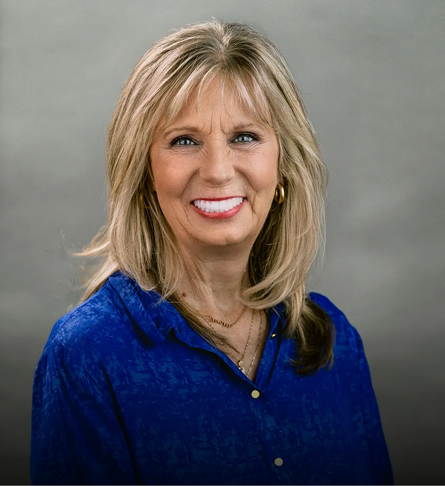 Winter Hollar, dental professional, headshot portrait in blue top