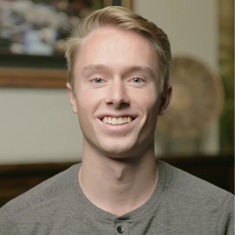 Man smiling at camera in dental office setting