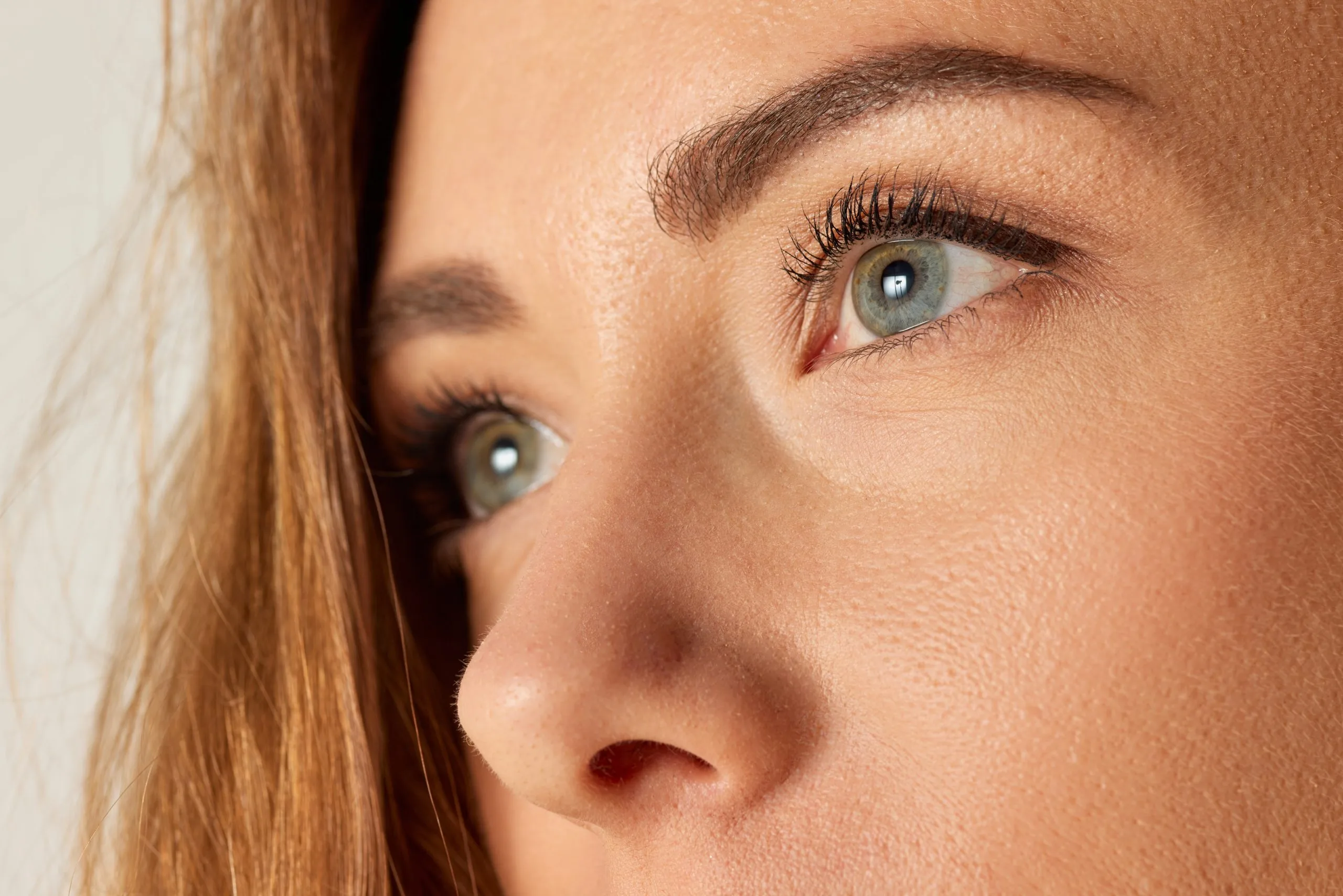 Woman in profile showing defined cheekbones and eye area