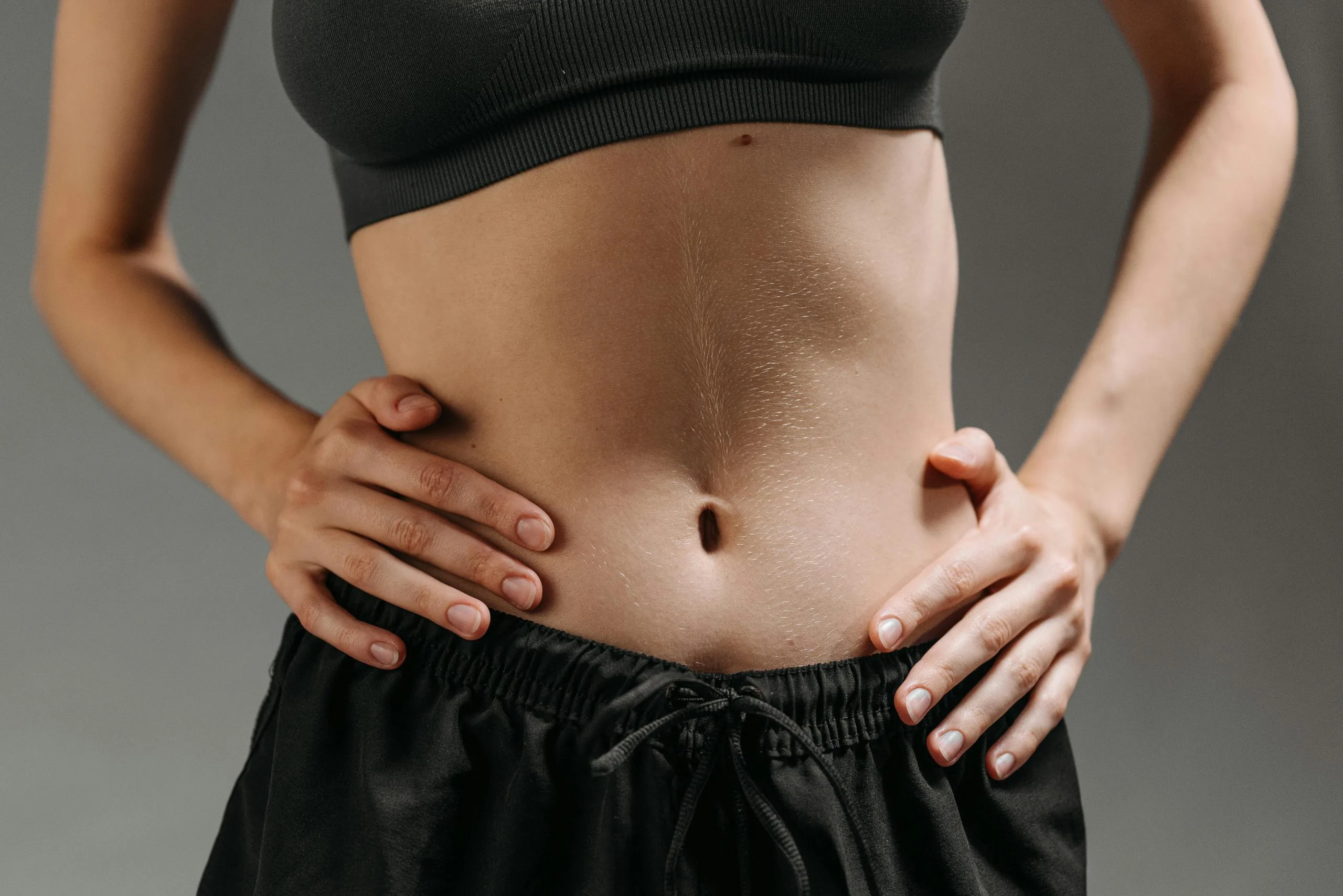 What Are Key Benefits of a Tummy Tuck Beyond Fat Removal? Banner